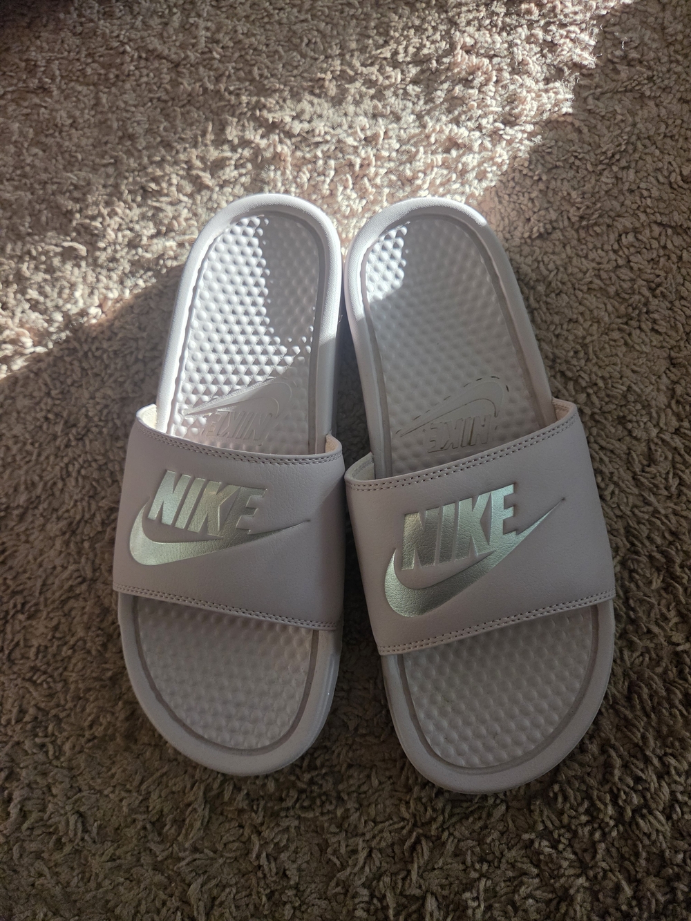 Nike Women's Light Pink Slide Sandals with Metallic Logo
